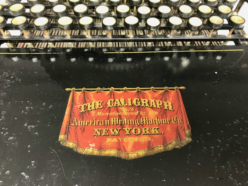 The Caligraph No. 2 decal is in extraordinarily good condition for an 1881 machine, particularly because the typist would have rested his/her hands on or near the metal typebar cover while typing.