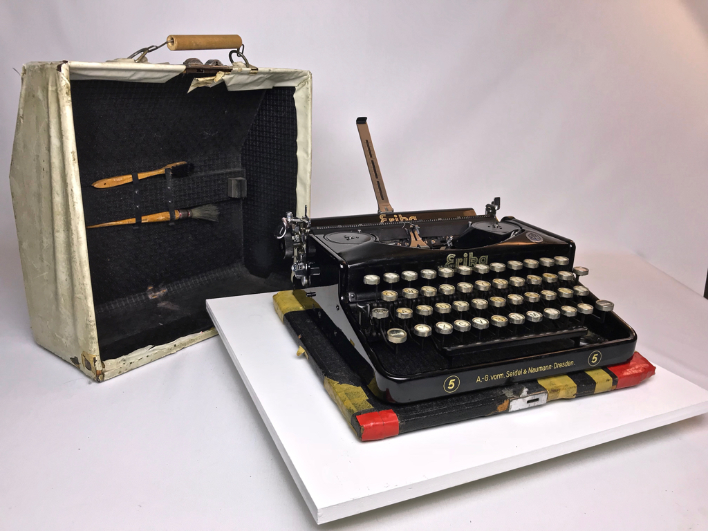 Typewriter shown with case